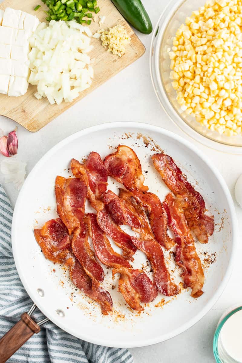 bacon strips cooked crispy in a skillet