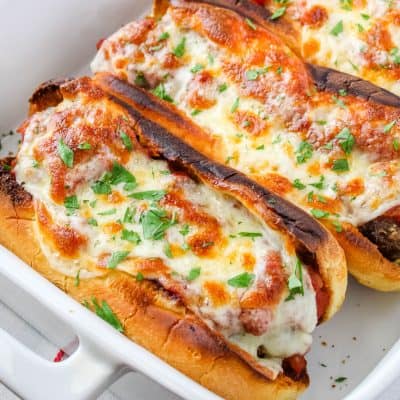 square image of meatball subs with parsley