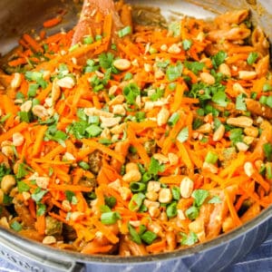 square image of thai peanut sauce pasta in a skillet after cooking