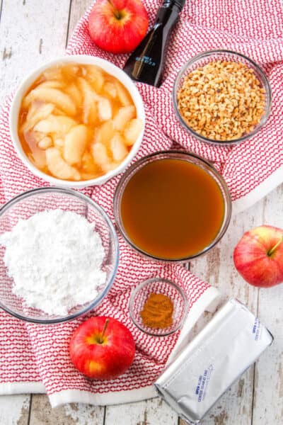 ingredients for caramel apple cheesecake dip in bowls