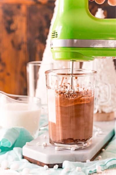 whipped hot chocolate in mixing glass with hand mixer