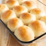 square image of dinner roll sin a dish after baking