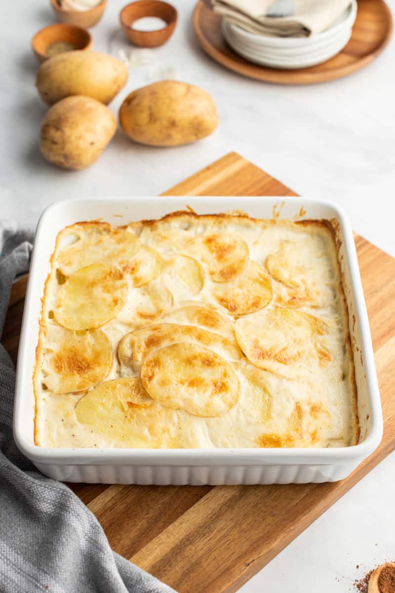 scalloped potatoes in a baking dish after cooking with golden top