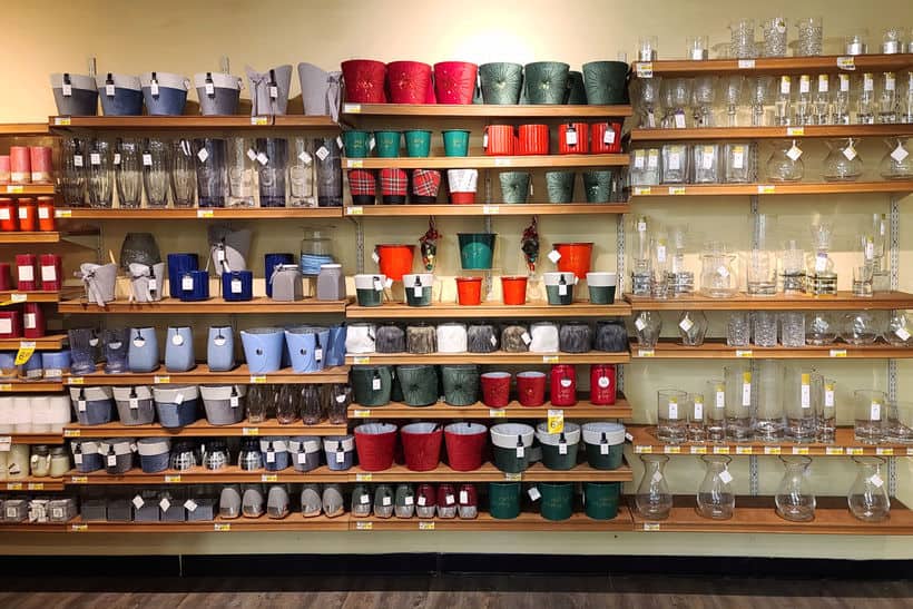debi lilly vases, glassware, and gift baskets on shelves at Safeway