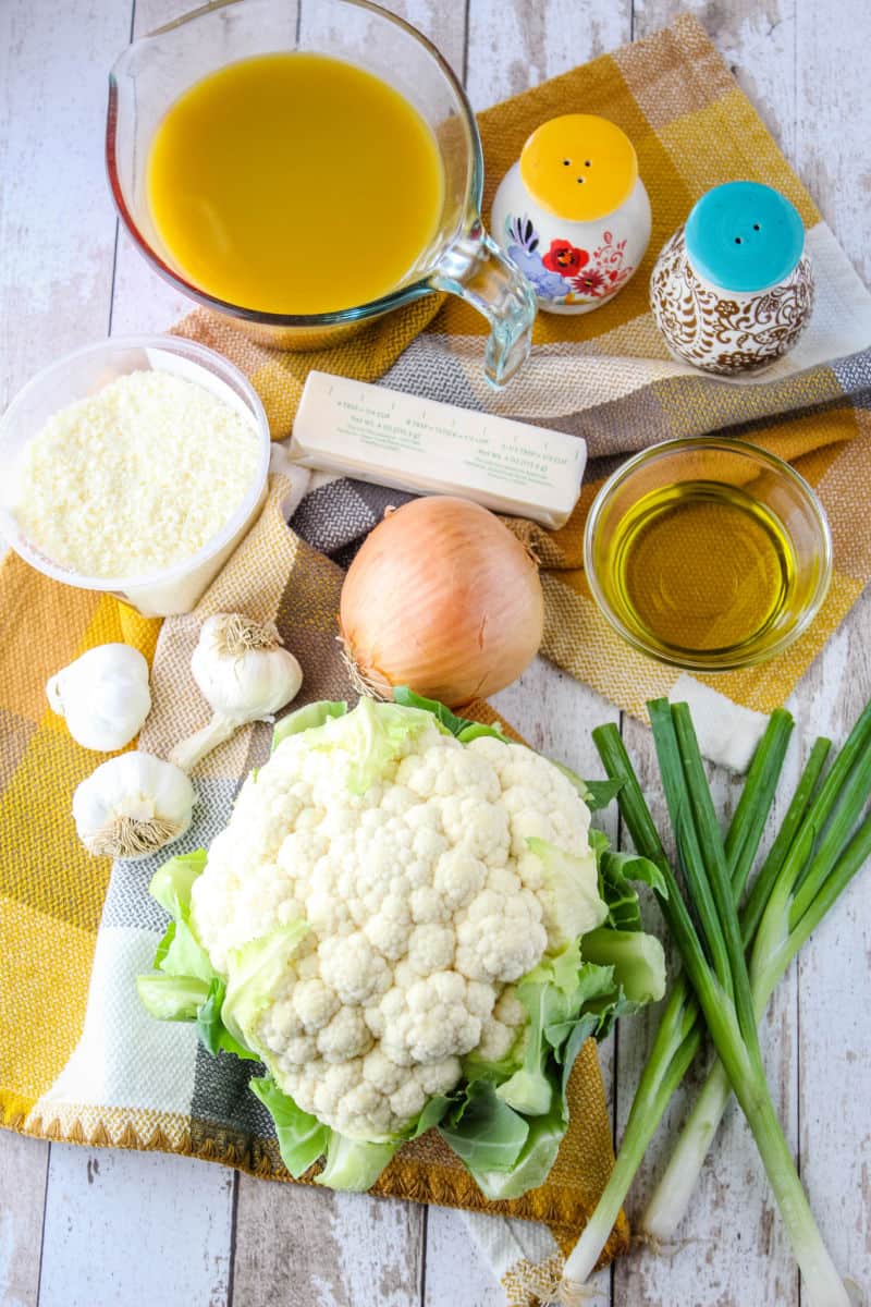 ingredients to make roasted garlic & cauliflower soup laid out on a tabletop