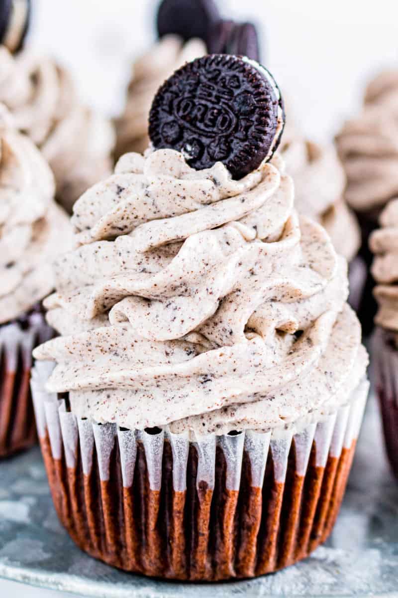 close up of an oreo cupcake with cookies and cream frosting