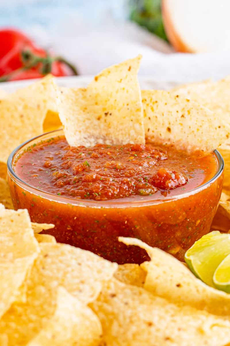 cloe up of a bowl of blender salsa with tortilla chips