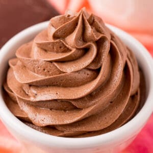 square image of chocolate pudding frosting piped into a small bowl