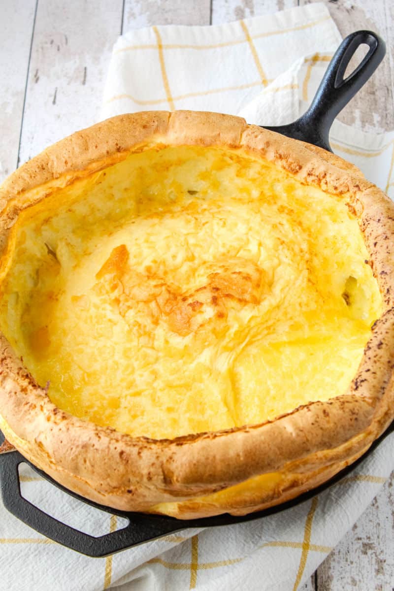 dutch baby in a cast iron skillet just out of the oven