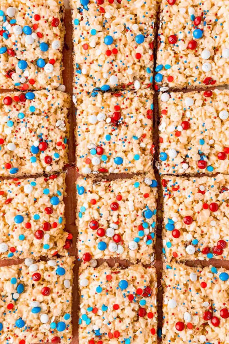 close up of 4th of july rice krispie treats cut into squares on a cutting board