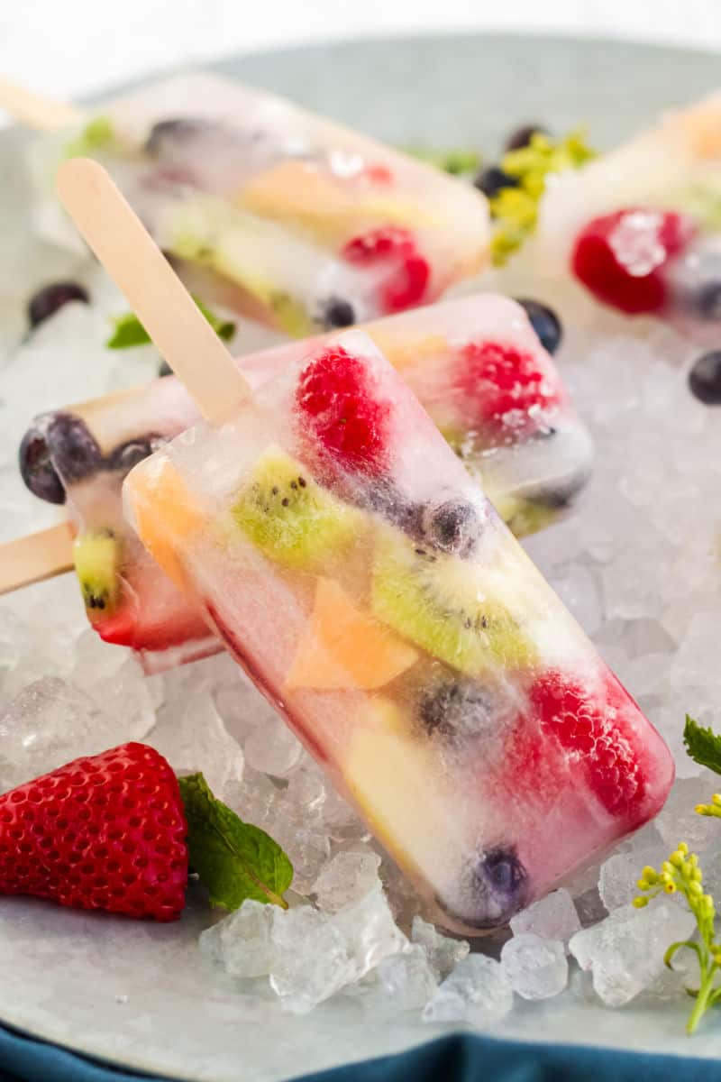 a fruit popsicle on a bed of ice