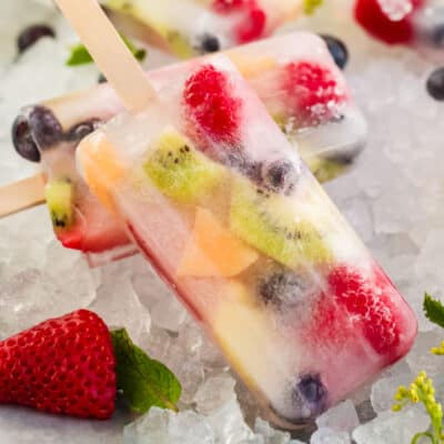 square image of a fruit popsicle on a bed of ice