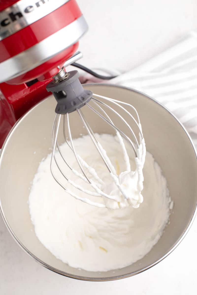 homemade whipped cream in a stand mixer with whisk attachment