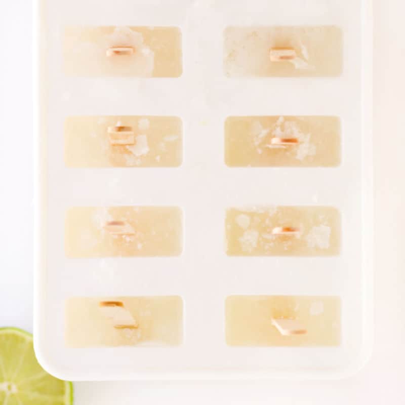 limeade popsicles in their molds after freezing