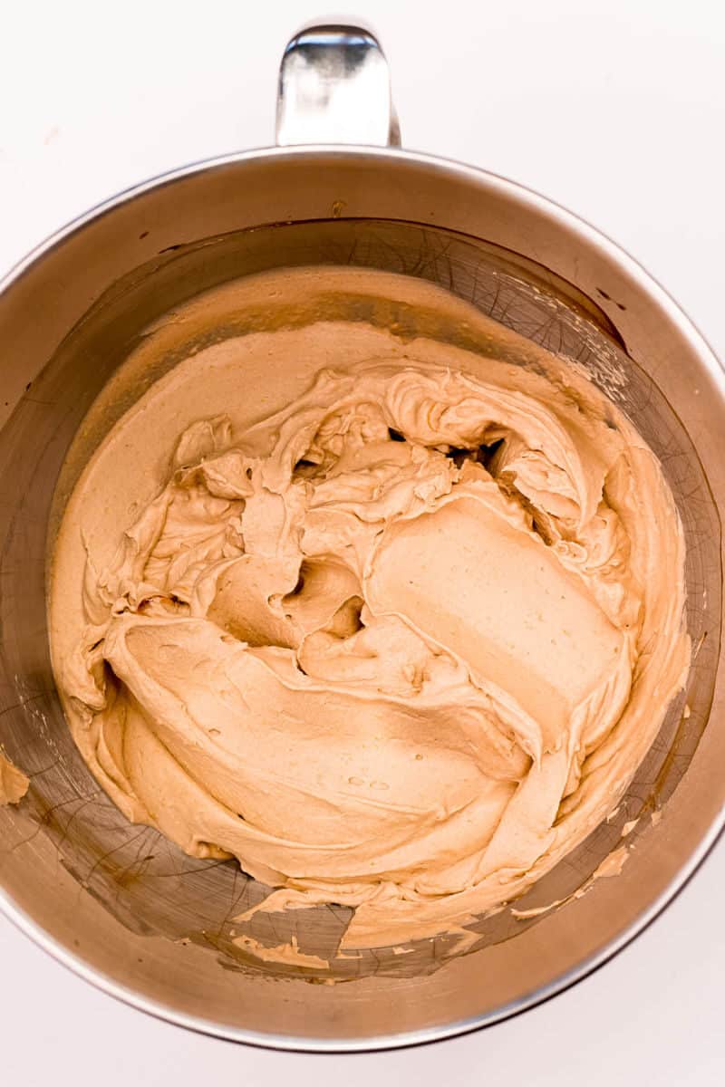 chocolate whipped cream frosting in the bowl of a stand mixer