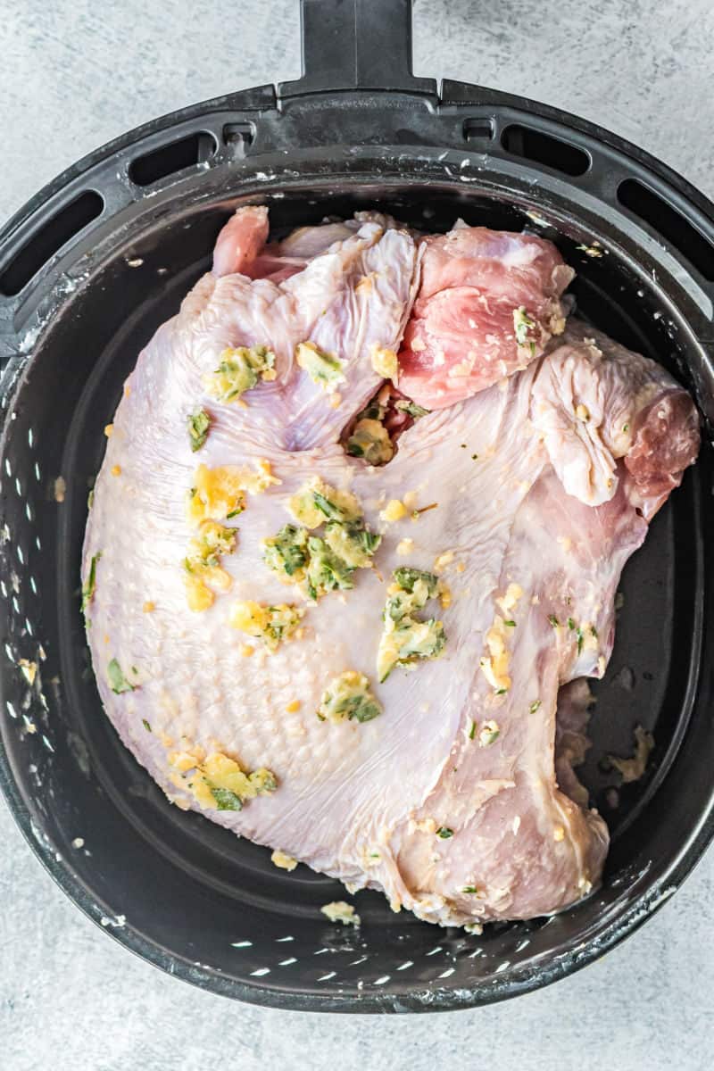 rubbed turkey breast in an air fryer basket