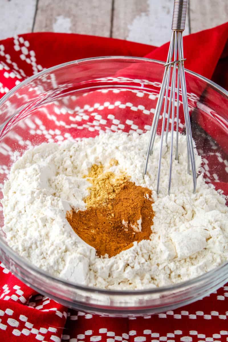 cinnamon spritz cookie dry ingredients in a bowl with a whisk