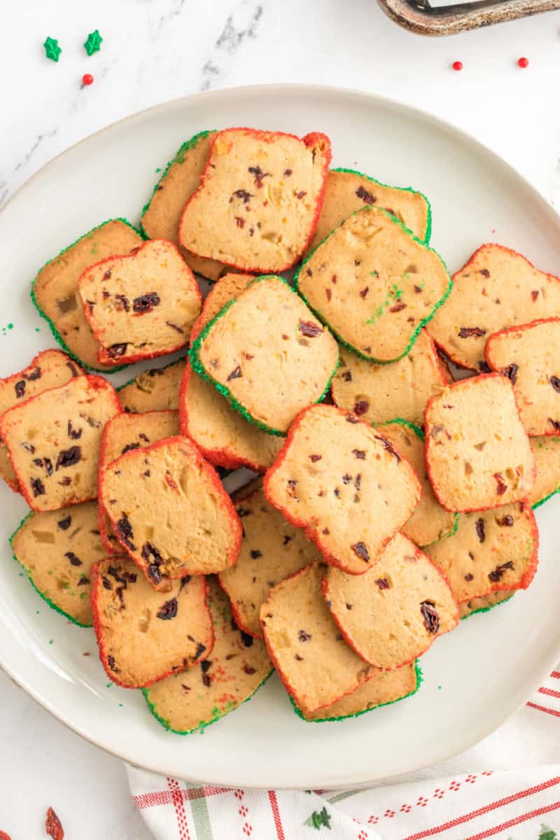 pile of cranberry orange icebox cookies on a plate