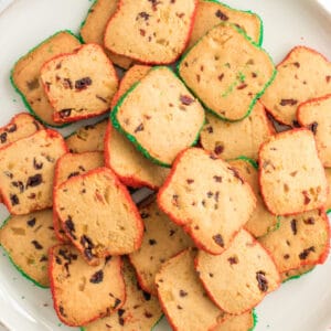 square image of cranberry orange icebox cookies piled up on a plate