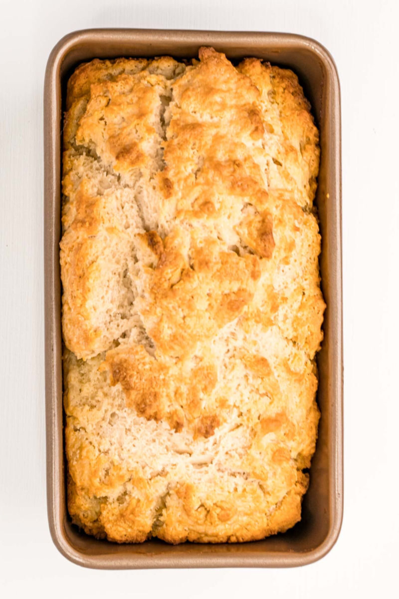 looking down at baked beer bread in a loaf pan