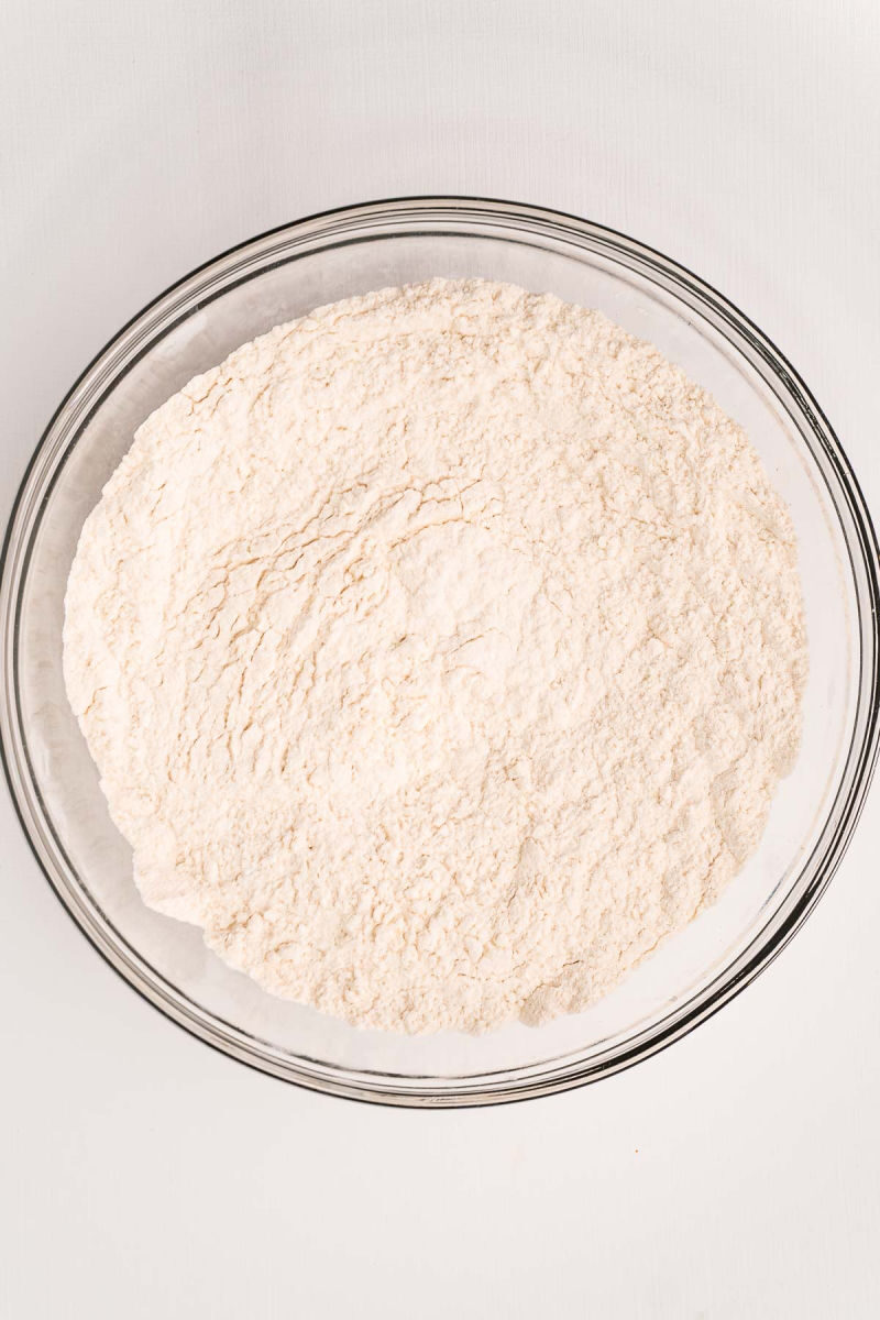 flour, sugar, and baking powder mixed together in a bowl