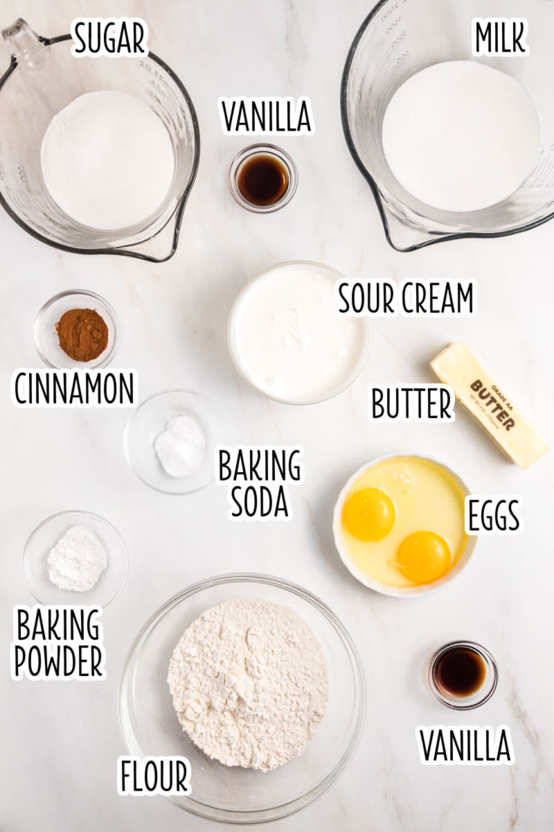 ingredients to make sour cream coffee cake on a counter with text labels