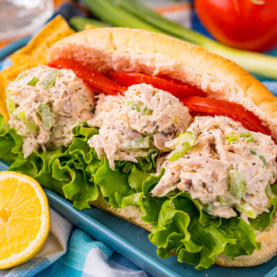square image of a chicken salad sandwich with lettuce and tomato