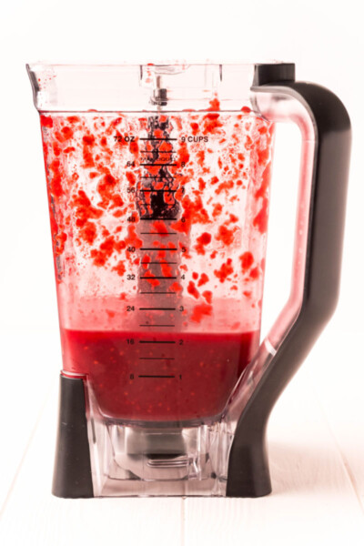 frozen raspberry daiquiri in a blender after being pureed