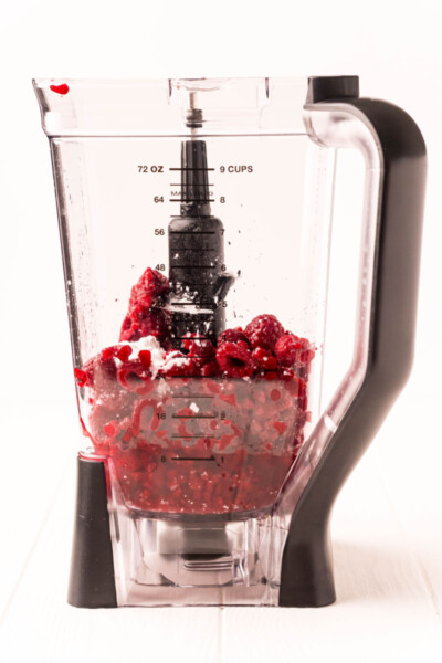 frozen raspberry daiquiri ingredients in a blender