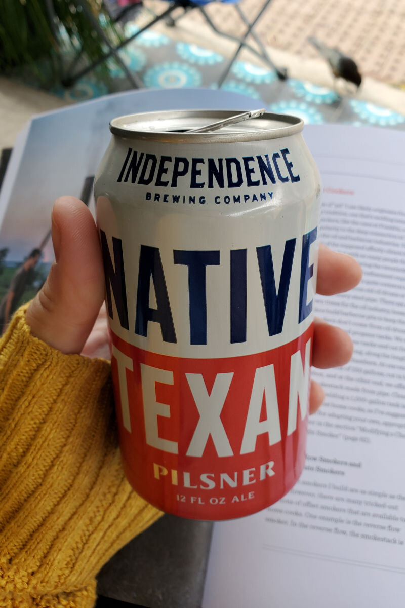 hand holding a can of Native Texan Pilsner from Independence Brewing
