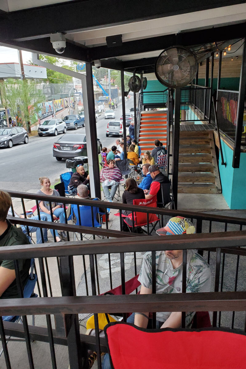 looking back at the line at Franklin Barbecue from the front door