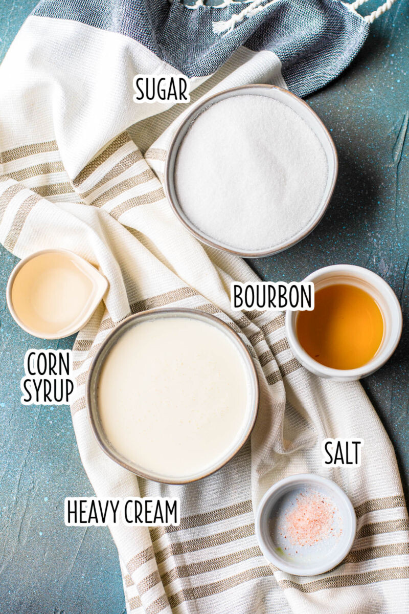 ingredients to make bourbon caramel sauce in bowls with text labels