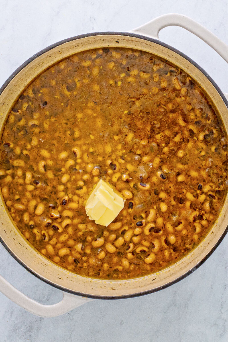 black eyed peas in a large pot after cooking with a nob of butter added in