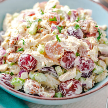 square image of chicken salad with grapes in a serving bowl