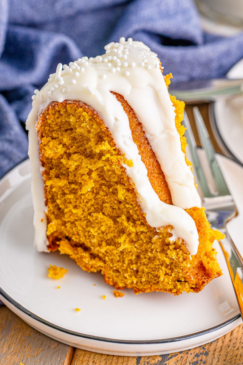 a slice of air fryer pumpkin bundt cake on a plate with a fork