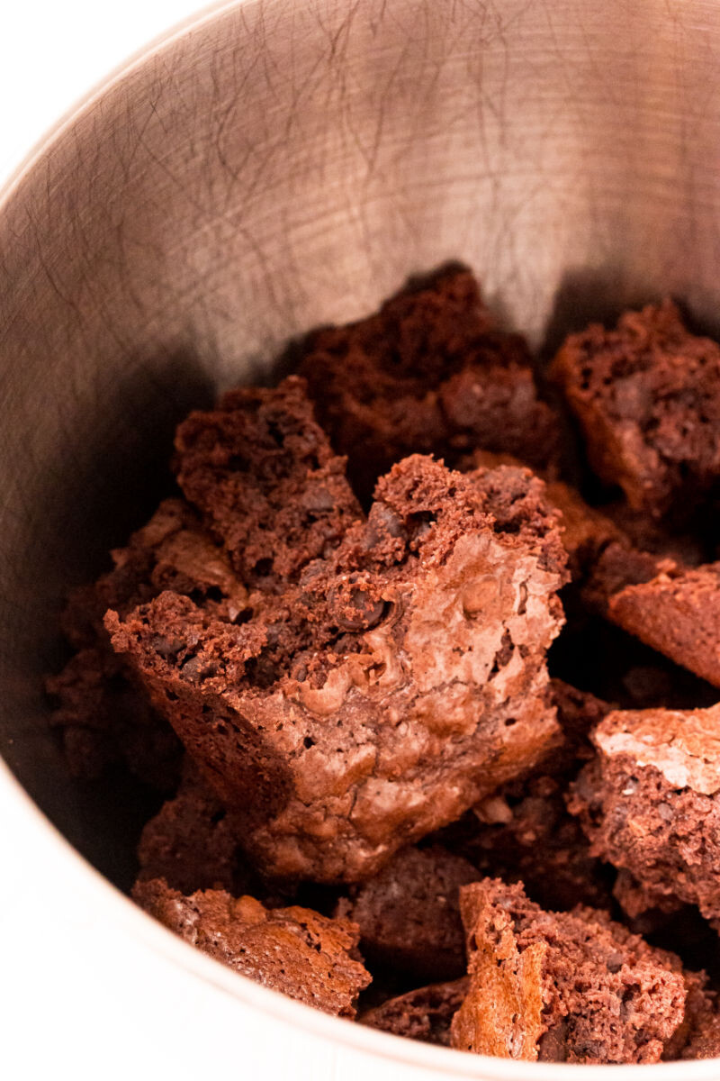 baked and cooled brownie chunks in a stand mixer bowl