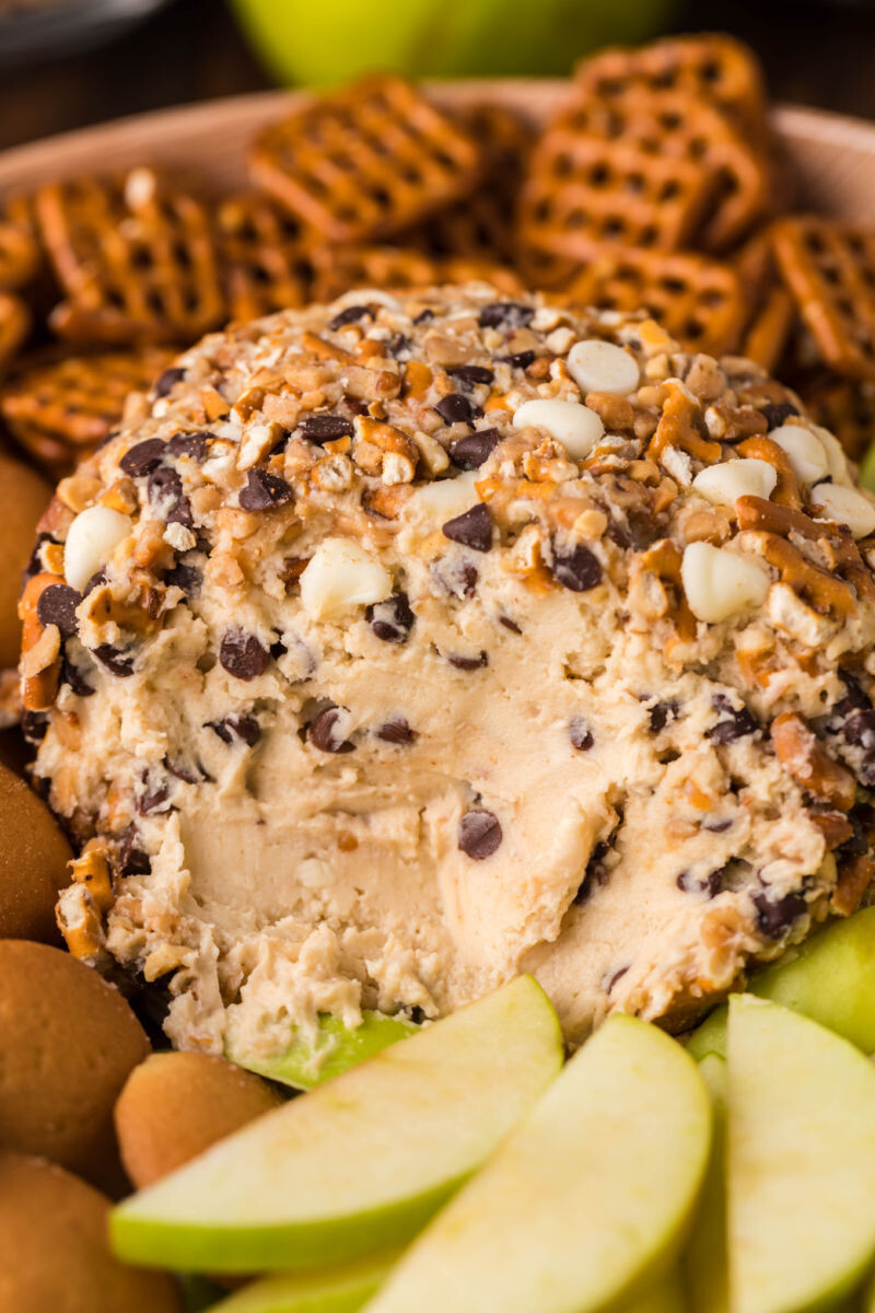 chocolate chip cheese ball with a section removed to show the filling inside