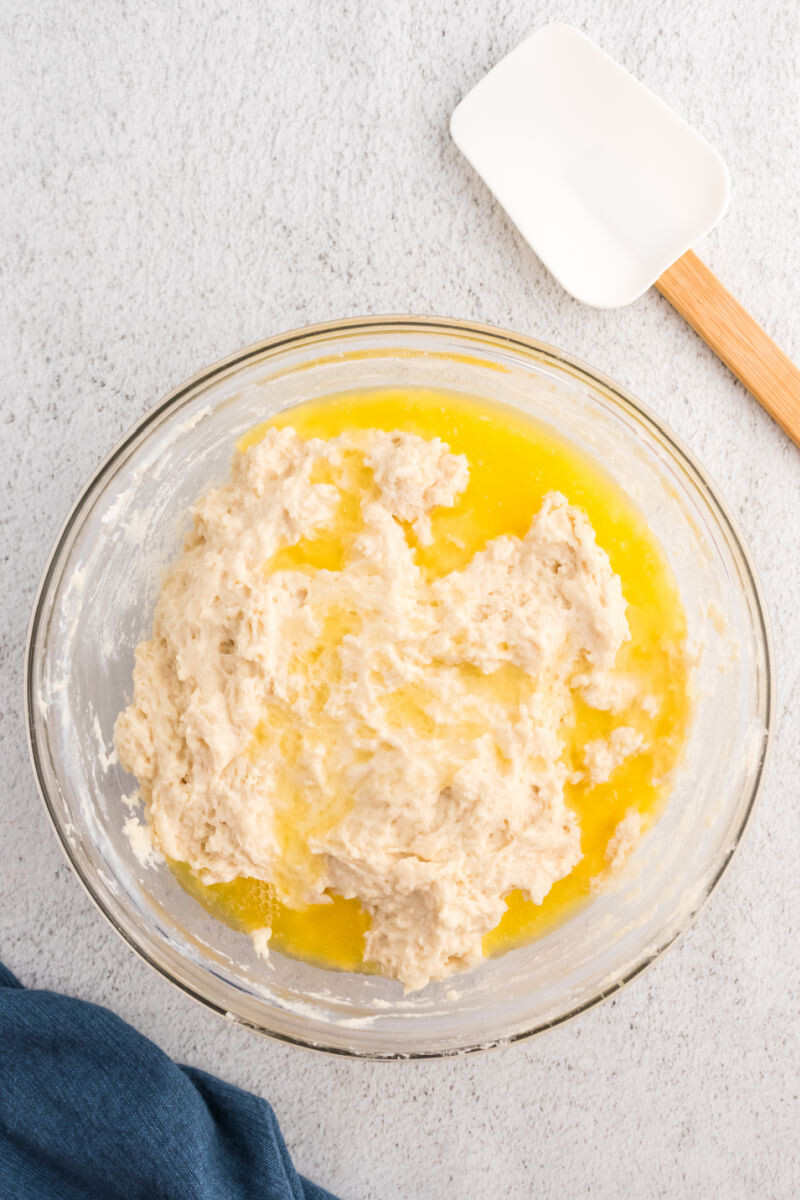 soda bread dough in a mixing bowl with melted butter