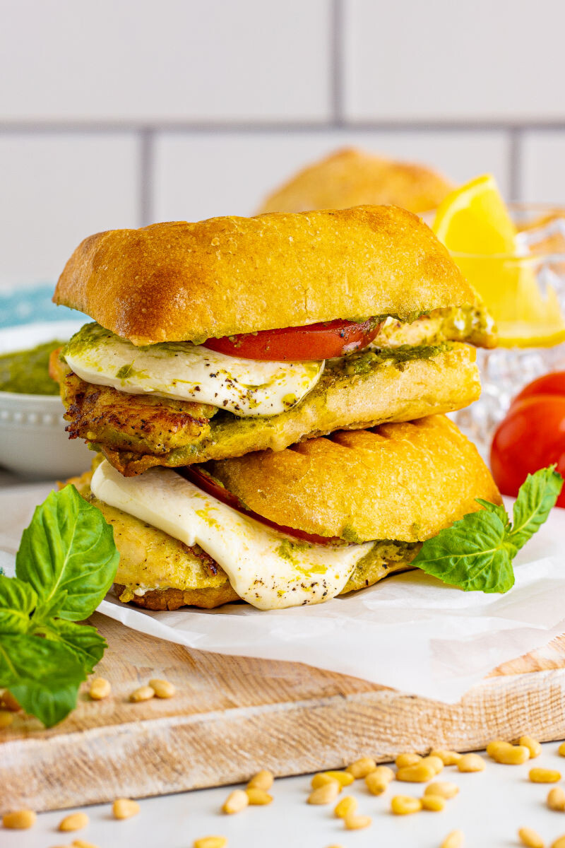 two pesto chicken sandwiches stacked on top of each other
