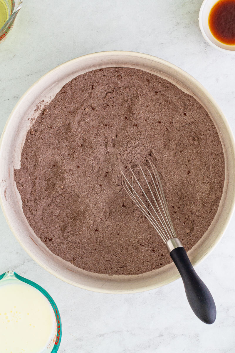 flour, sugar, brown sugar, cocoa powder, salt, and baking powder whisked together in a mixing bowl