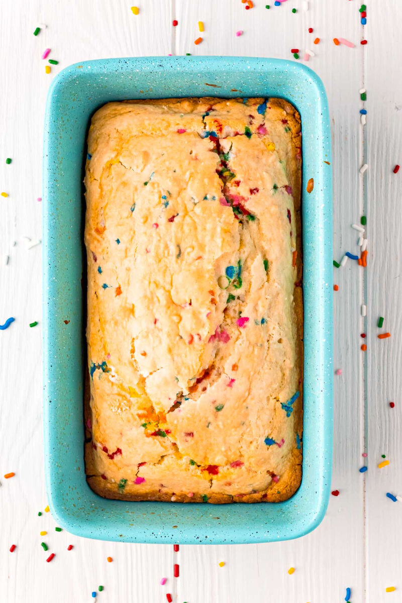 baked loaf of funfetti ice cream bread in a pan
