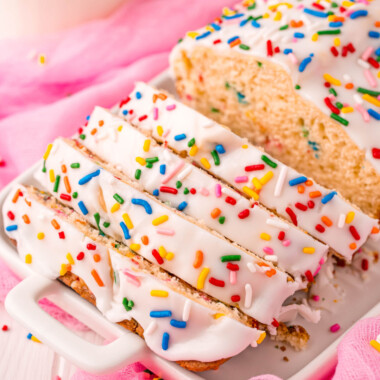 square image of funfetti ice cream bread with slices cut from the loaf