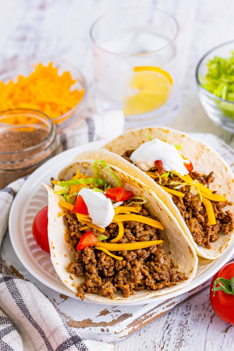 two ground beef tacos on a plate