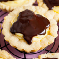 square image of a copycat crumbl boston cream pie cookies on a wire rack