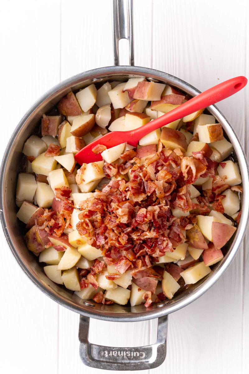 cooked potatoes and chopped bacon added to the skillet with sauce