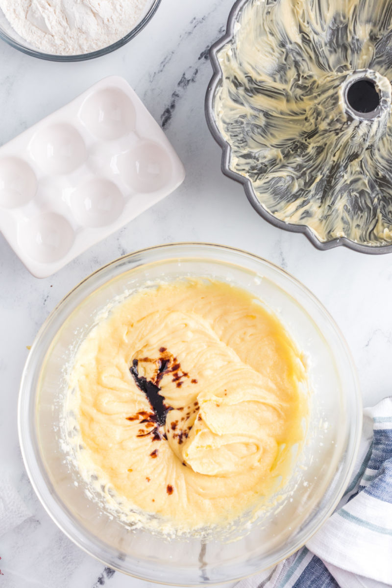 vanilla added to beaten honey, sugar, butter, and eggs in a mixing bowl