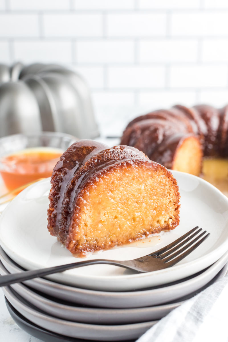 slice of Rum-Soaked Honey Pound Cake on a plate with a fork