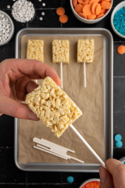 lollipop stick being pushed into a rice krispie treat