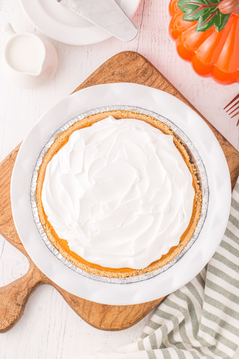 looking down at a no bake pumpkin pie topped with whipped cream