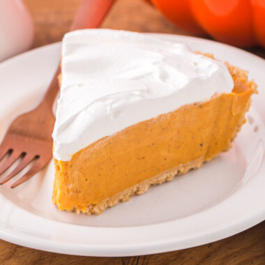 square image of a slice of no bake pumpkin pie on a plate with a fork